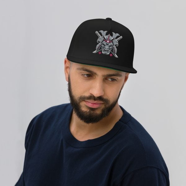 A Toyota Supra MKIV "The Samurai" Flat Bill Cap wearing a black hat with a skull and crossbones on it.
