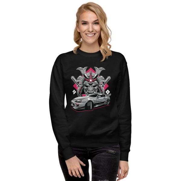 A woman wearing a black "The Samurai" Toyota Supra MKIV Sweatshirt - Unisex Premium.