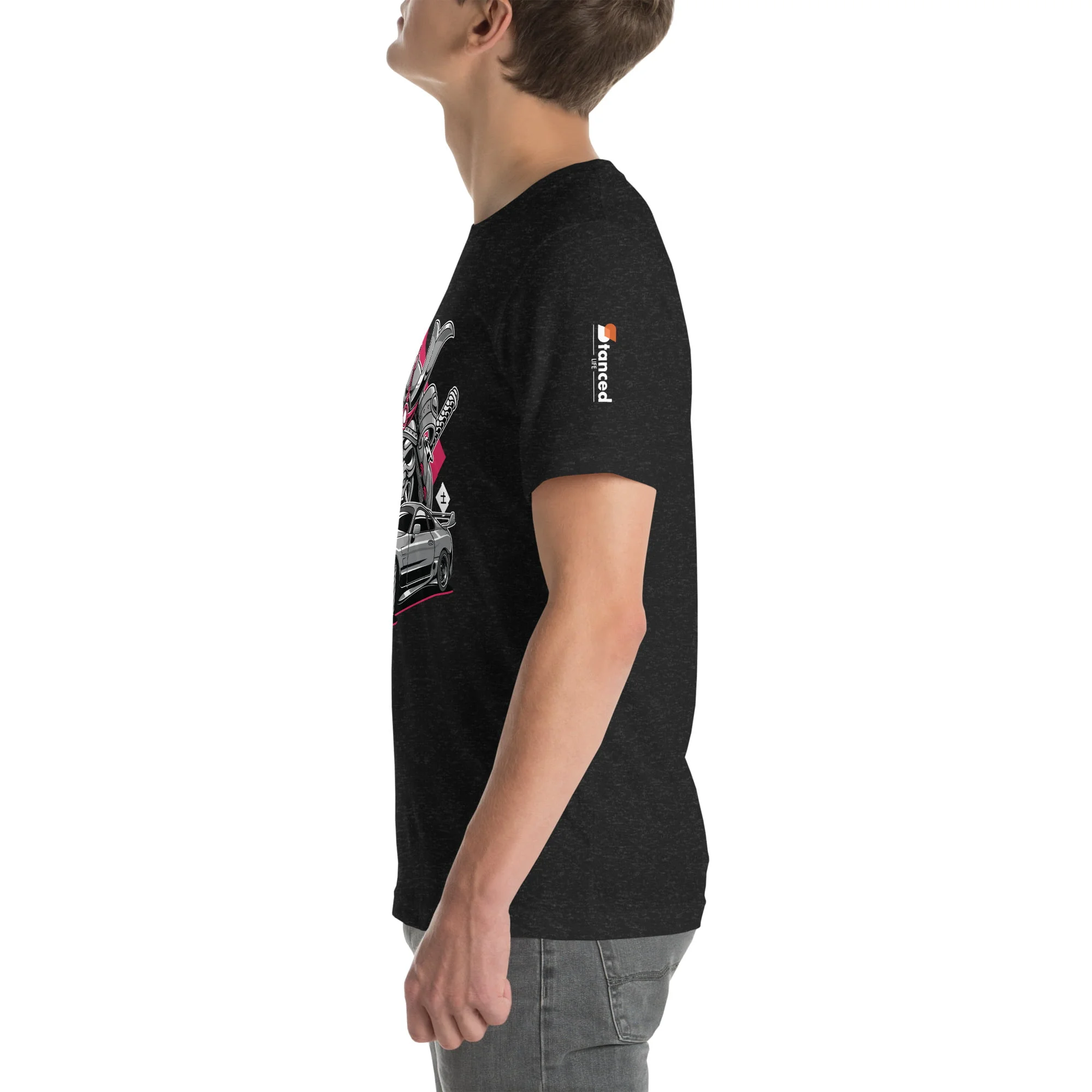 A man wearing a Toyota Supra MKIV "The Samurai" unisex t-shirt with a hint of Samurai influence.