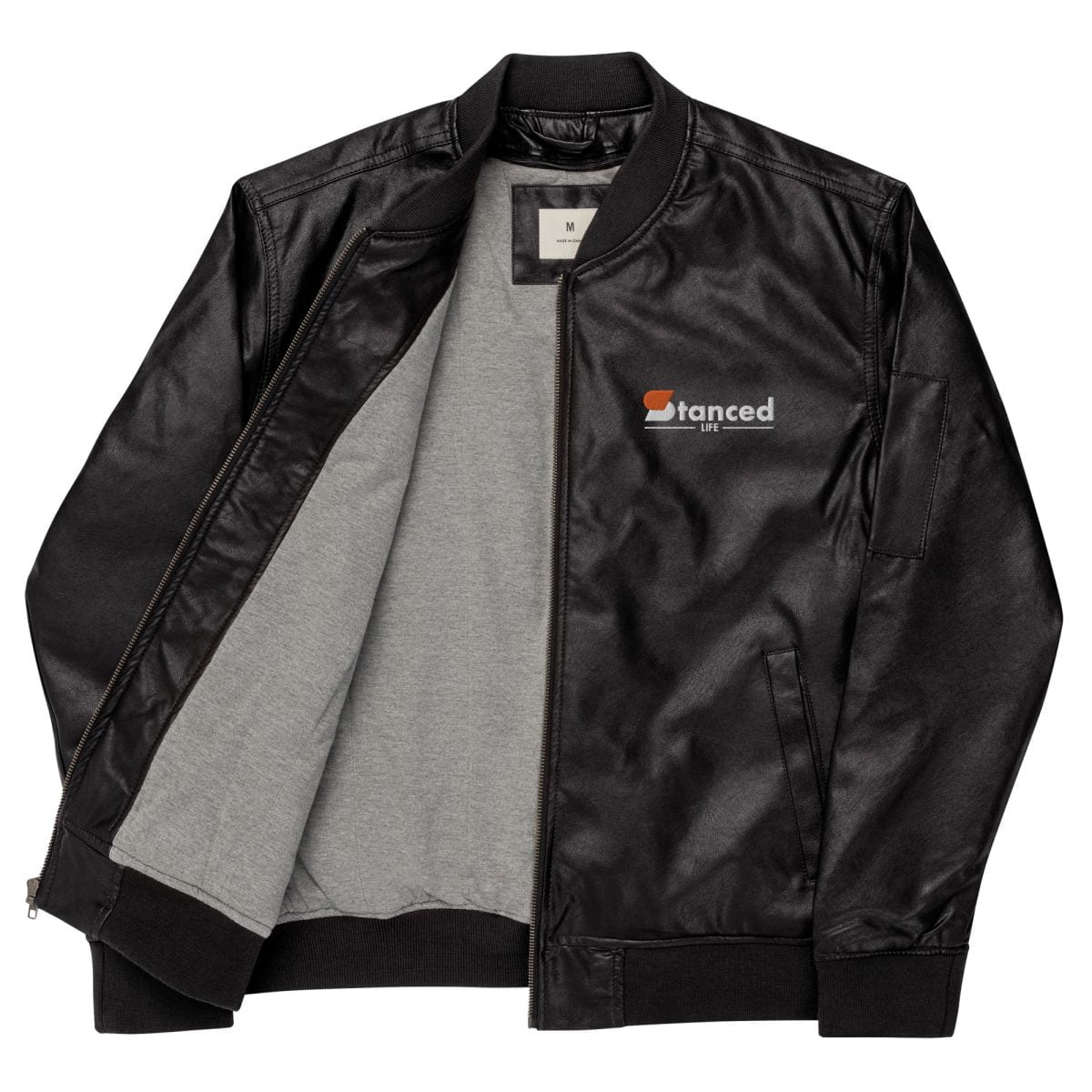 A black leather jacket with a grey and white 2JZ logo perfect for the StancedLife enthusiasts | StancedLife