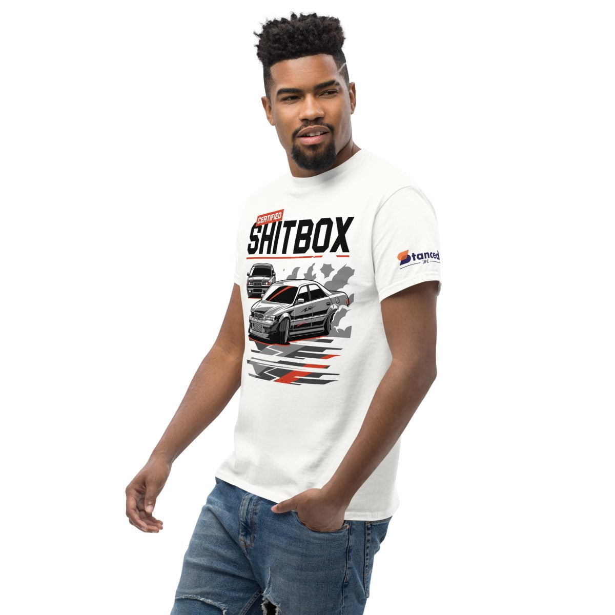 A man wearing a E36 BMW JDM JZX100 Toyota Chaser Drifting Mens T shirt Certified Shitbox showcasing his love for JDM and drifting | StancedLife