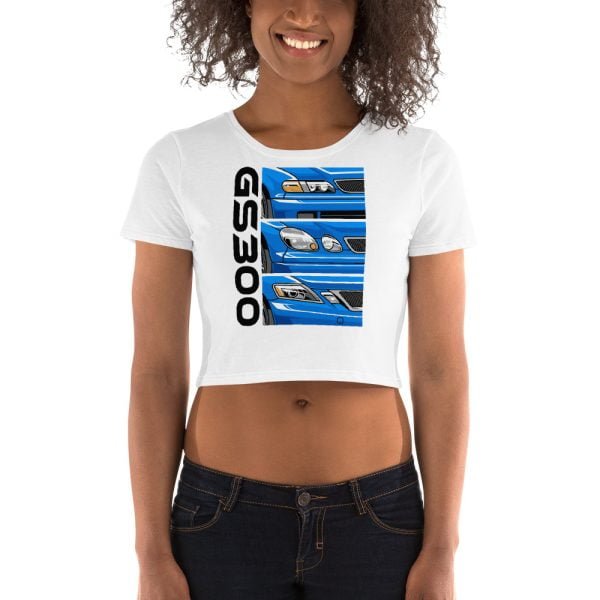 A woman wearing a white Lexus GS300 JZS161 Generations women’s crop tee featuring a blue car design.